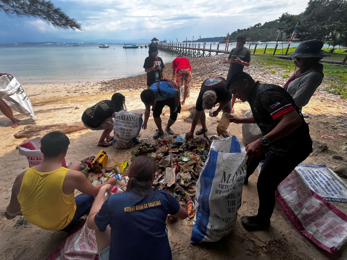 Volunteers segregating trash for data collection