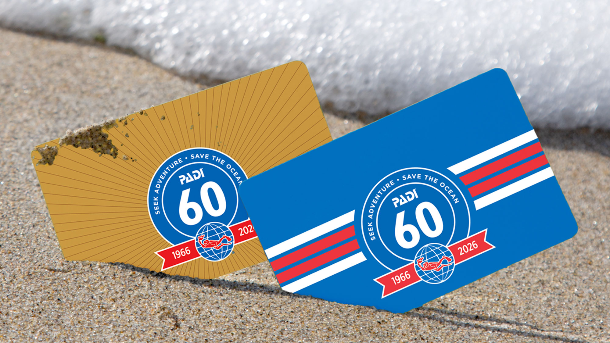 Two PADI 60th Anniversary certification card designs displayed side by side