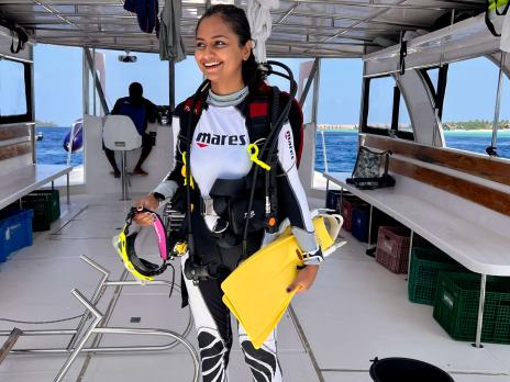 Sharanya Iyer on a boat getting ready for a dive