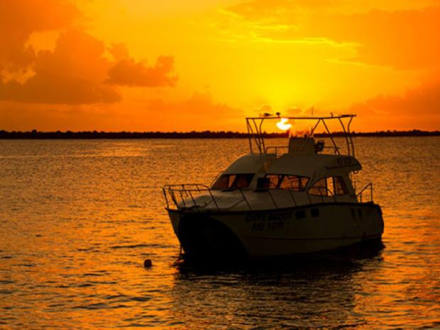 PADI Boat in Sunset - Travel