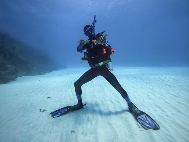 Barrington Scott posing for a picture while diving