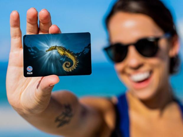 image of woman holding a certificaton card