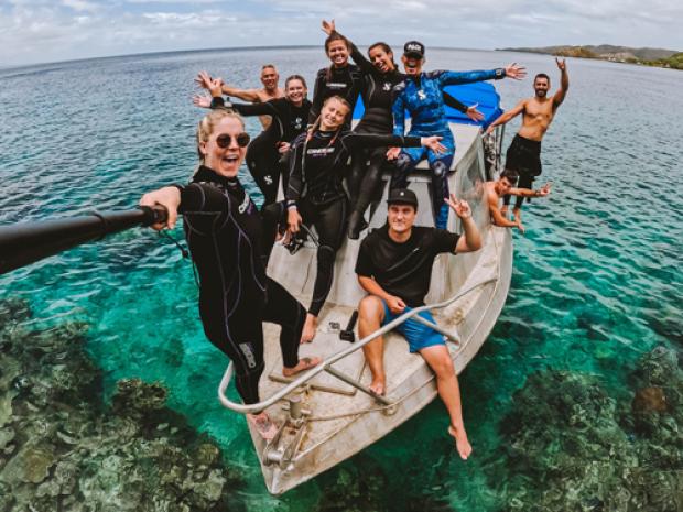 A group of people taking a selfie.