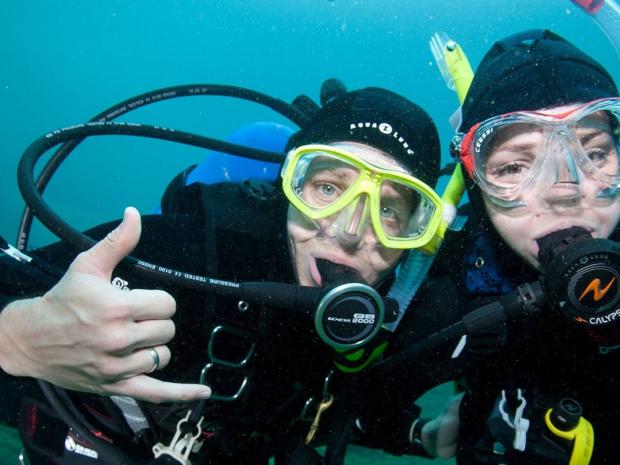 Divers posing for the camera