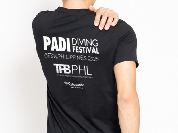 backside of black T shirt with PADI Diving Festival logo on it