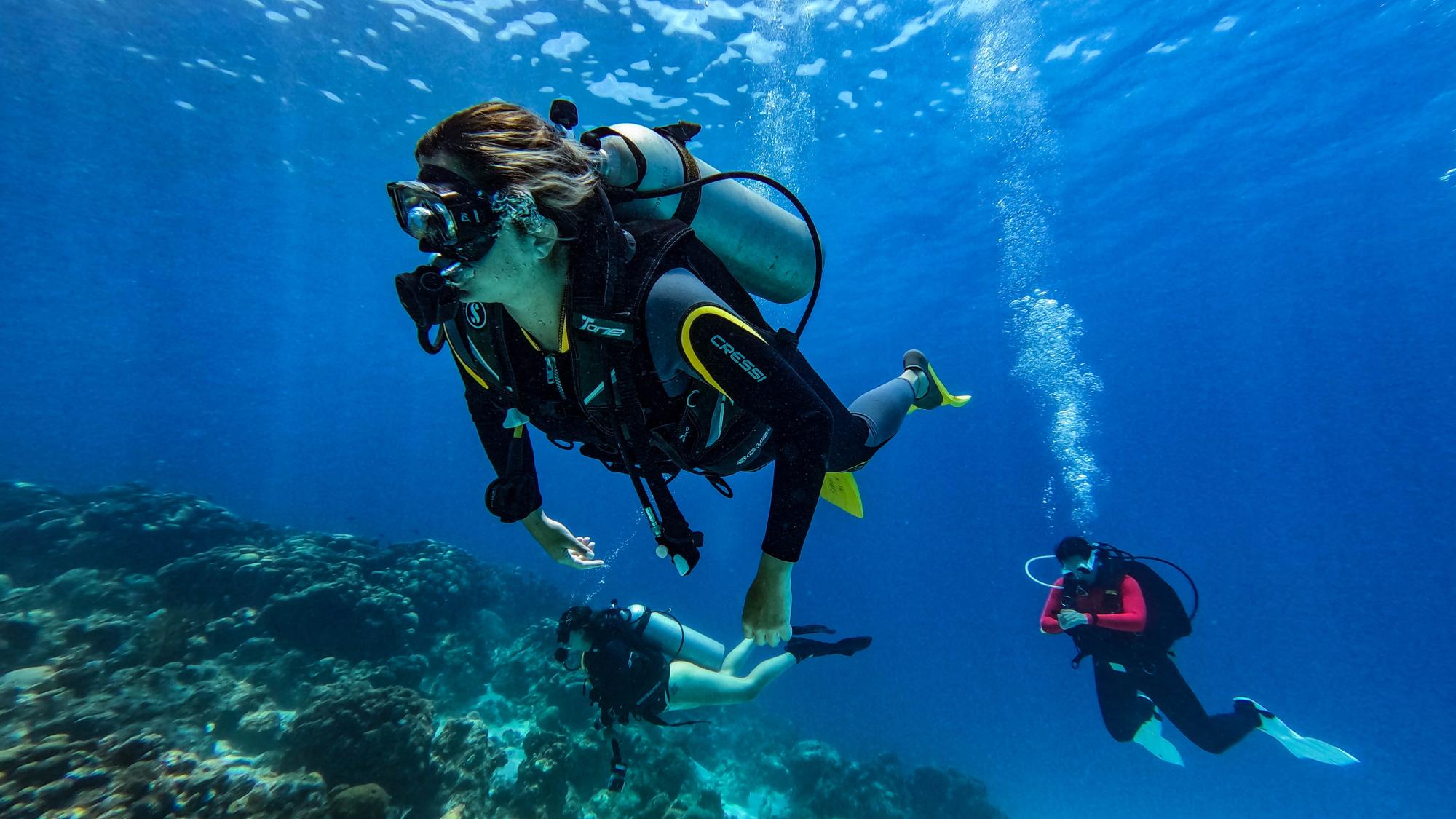 3 scuba divers underwater