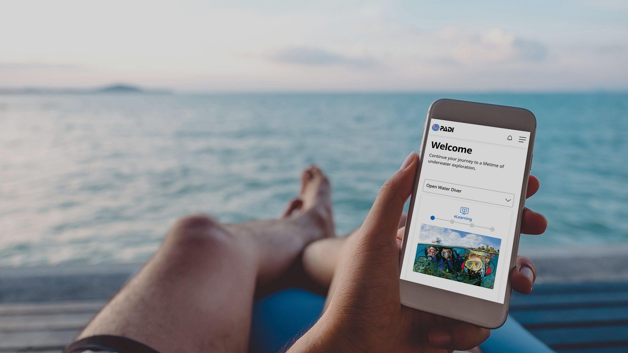 doing PADI eLearning on the beach