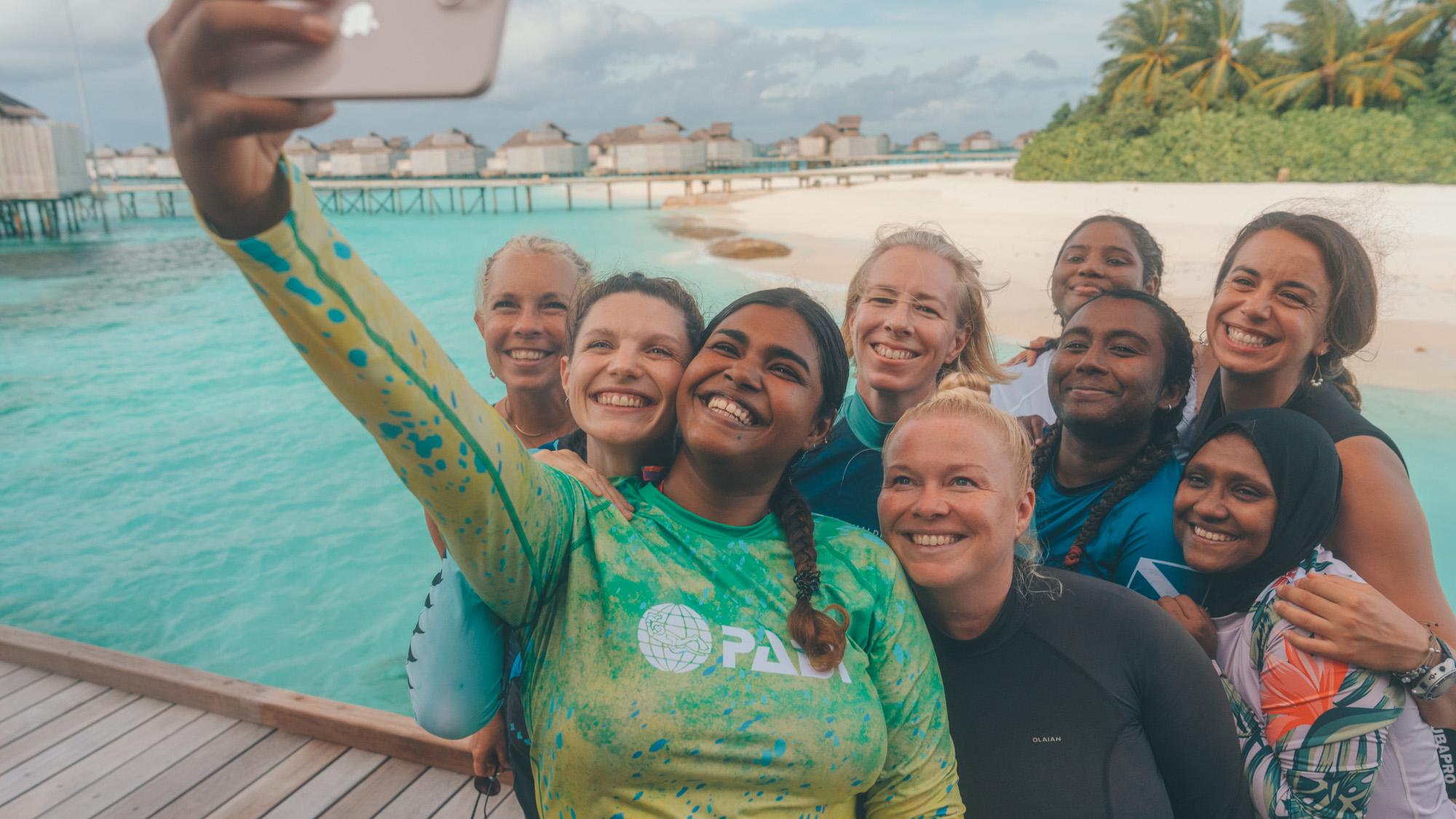 A group of divers taking a selfie.
